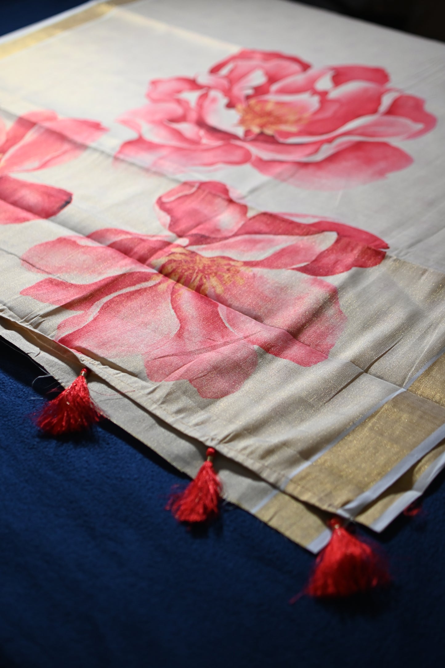 Tissue Saree with Coral Floral Print & Tassel Pallu